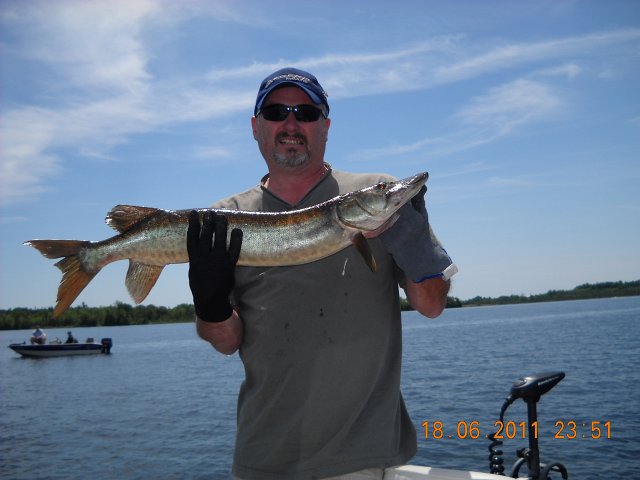 010.JPG - Rob with a Muskie from Sturgeon Lake.