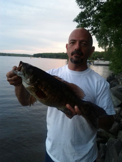 345362363265.JPG - Tony with a great smallmouth from the cottage near Marmora.