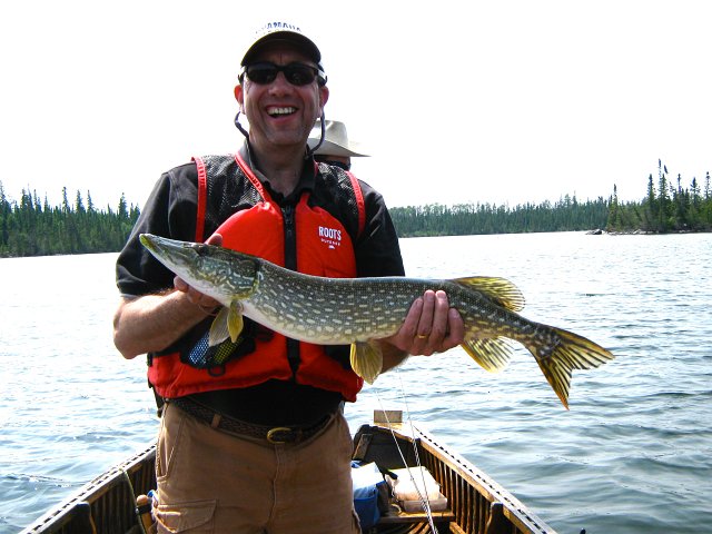 IMG_0544.JPG - Chris at Esnagami Lodge with a great smile after catching another Northern Pike.