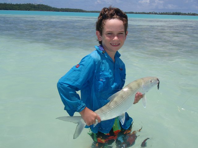 P1040465.JPG - While in the Aitutaki Cook Islands, 8 year old Alex with his first bonefish (spin gear) - He used 4/0 jig head & modified Berkley 4” black shad gulp minnow.