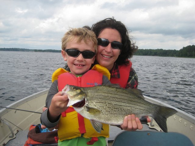 Wiper.jpg - Amie and Liam with a Striped Bass caught below Stony Rapids, on the French River, Ontario - August 2009.