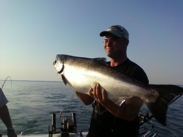 photo1223414.JPG - Aaron with a beautiful Lake Ontario Chinook Salmon caught while trolling off of Port Dalhousie with a Green Michigan Stinger Spoon.