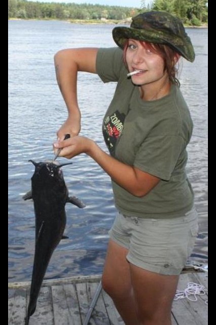 photojena52435425.PNG - Jeana with a Catfish from the dock!