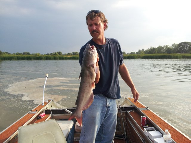 20120804_183323.jpg - Mike foster with an 8.5 lb channel cat caught by the dam in dunville using worm.
