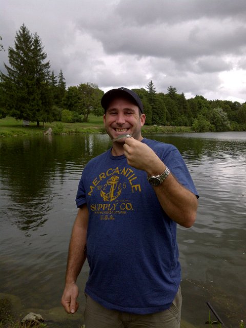 Guelph-20120812-00134.jpg - Blayne holding a Largemouth Bass ... Yes there is a fish in the picture ....