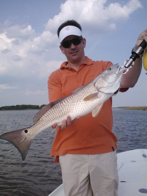 IMG077.jpg - Eric and a Redfish caught in Charleston South Carolina.