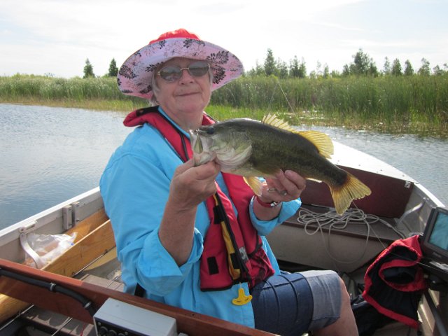 IMG_1548.JPG - Anna holding a Largemouth Bass from Bay of Quinte.