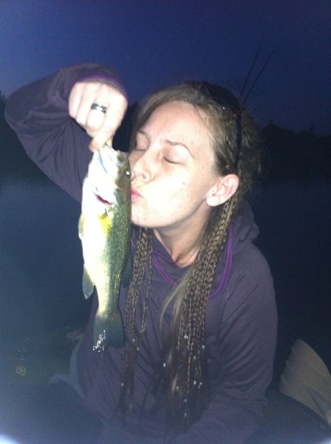 image_43524525.jpeg - Melissa kissing a night-time largemouth from the small side of Guelph Lake.